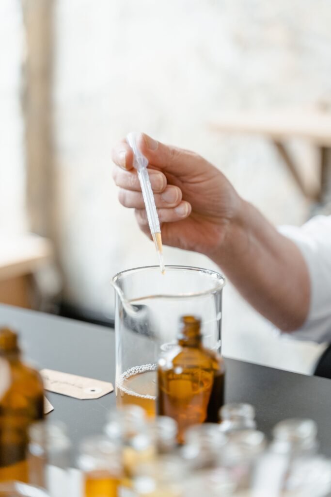 Pouring Golden Oil Raven Beard Oil Bottle
